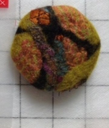 Button that Melissa Arnold is going to teach participants in the Collaged Nuno Felt Wrap Class to make in May
