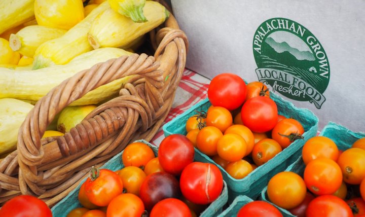 food box with local squash and tomatoes