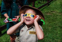 kid with eclipse glasses