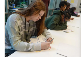 student working on infographic